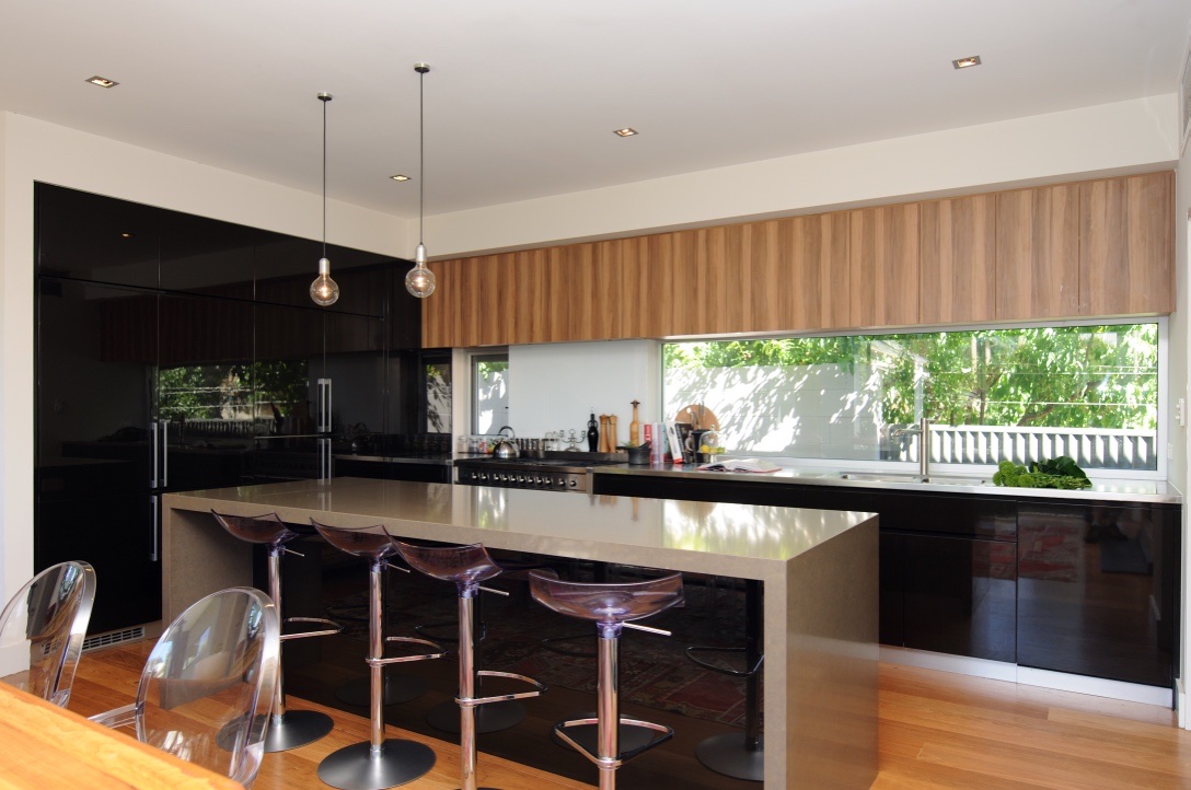 Kitchen with timber batten joinery and mirrored splashback window